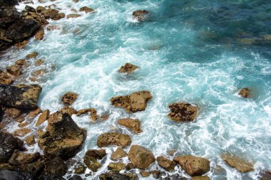 Rocks in the breakers on the coast of the Canary Island of Tenerife, Spain