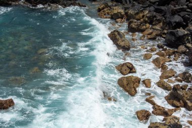 Rocks in the breakers on the coast of the Canary Island of Tenerife, Spain