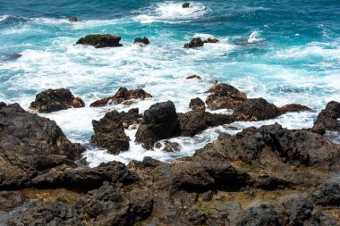 Rocks in the breakers on the coast of the Canary Island of Tenerife, Spain