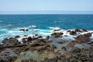 Rocks in the breakers on the coast of the Canary Island of Tenerife, Spain