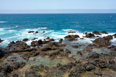 Rocks in the breakers on the coast of the Canary Island of Tenerife, Spain