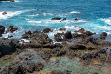 Rocks in the breakers on the coast of the Canary Island of Tenerife, Spain