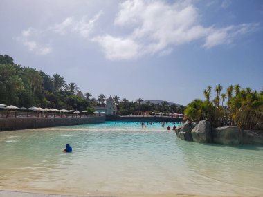 Siam Park, Costa Adeje, Tenerife, Spain - August 9, 2022 - In the Palacio de Olas wave pool in the largest water park in Europe , located in the south of the Canary Island of Tenerife in Costa Adeje