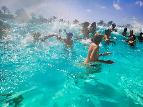 Siam Park, Costa Adeje, Tenerife, Spain - August 9, 2022 - In the Palacio de Olas wave pool in the largest water park in Europe , located in the south of the Canary Island of Tenerife in Costa Adeje