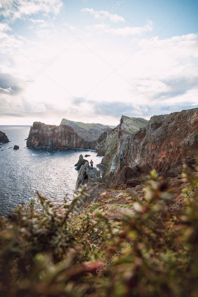 passionate traveller and hiker discovers the beauty of the ponta de sao lourenco area on the island of Madeira, Portugal at sunrise. A view of part of the wild nature of the peninsula.