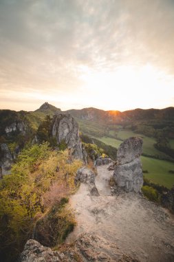 Sunrise at Sulov Rocks in eastern Slovakia. Rough, untouched landscape with rocks in orange light.