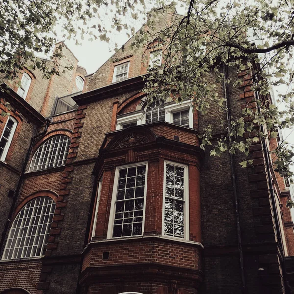 Old building in London UK with front porch window sticking out from the side of the house. . High quality photo