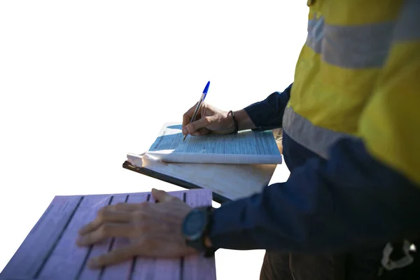 Miner supervisor sign of approval working at height working permit prior to performing high risk work on construction site of each task with clipping paths dropped shadow isolated white background 
