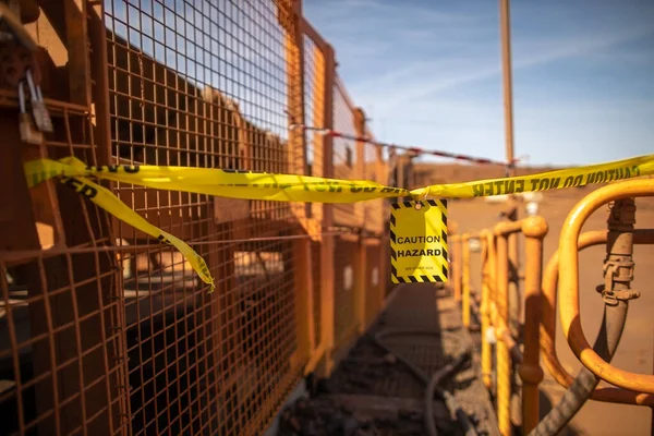 Safety. work place yellow caution sign/ symbols tag applying on the entry construction workplace to ensure safety warning precaution in place from public access construction site Sydney 