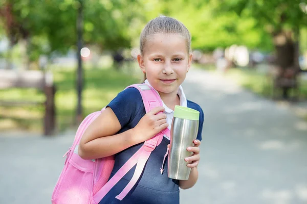 Smiling Schoolgirl Goes School Pink Backpack Metallic Thermo Cup Concept — Stockfoto
