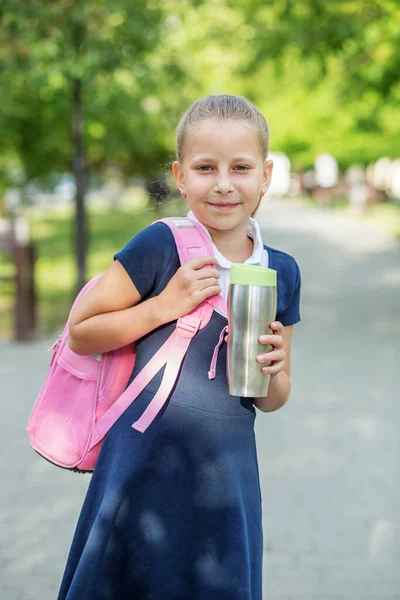 Smiling Schoolgirl Goes School Pink Backpack Metallic Thermo Cup Concept — Stock fotografie