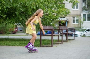 Child rollerblading fast at skate park. Having fun. Concept of an active lifestyle, hobbies and childhood