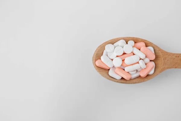 Many Different Pills Wooden Spoon White Background Copy Space Top — Foto Stock