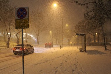  street under the snow during snow blizzard in winter