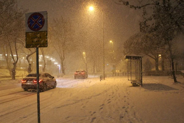 street under the snow during snow blizzard in winter