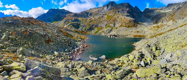 Mountain panorama.  Mountain rocky landscape. Panoramic photo of mountain peaks and valleys. Majestic view of the rock peaks. High-resolution picture. Real photo of Tatra Mountains in Slovakia.