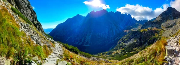 Mountain panorama.  Mountain rocky landscape. Panoramic photo of mountain peaks and valleys. Majestic view of the rock peaks. High-resolution picture. Real photo of Tatra Mountains in Slovakia.