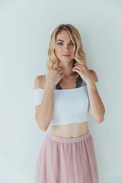 Portrait of a beautiful blonde woman in a light summer dress — Stock Photo, Image