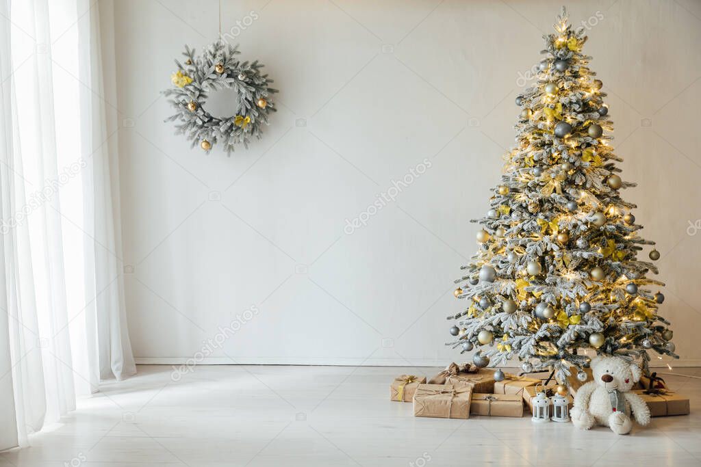 Interior of the house with white Christmas tree lights garlands gifts new year
