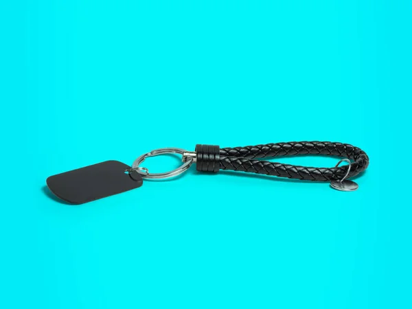 key chain, metal and leather material key chain isoleted on blue background