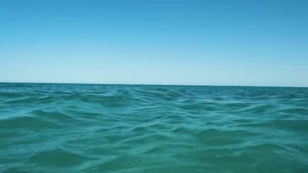 Closeup seascape surface of blue sea water with small ripple waves — Stock Video