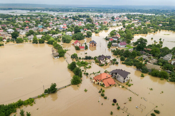 Aerial view of flooded houses with dirty water of Dnister river in Halych town, western Ukraine