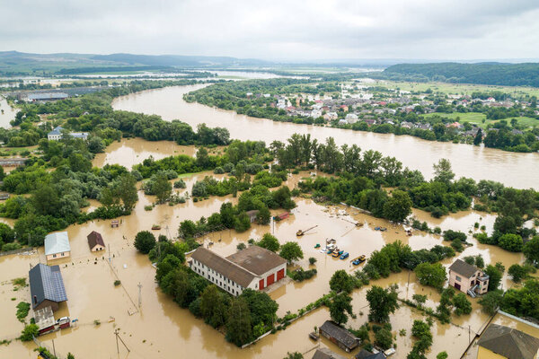 Aerial view of flooded houses with dirty water of Dnister river in Halych town, western Ukraine