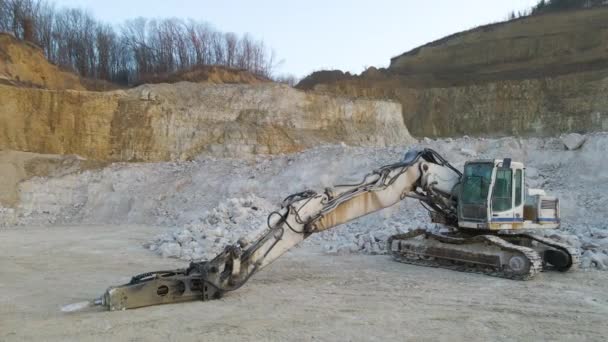 Open pit mining site of construction sand stone materials with excavator equipment for digging of gravel resources at quarry — Stock Video