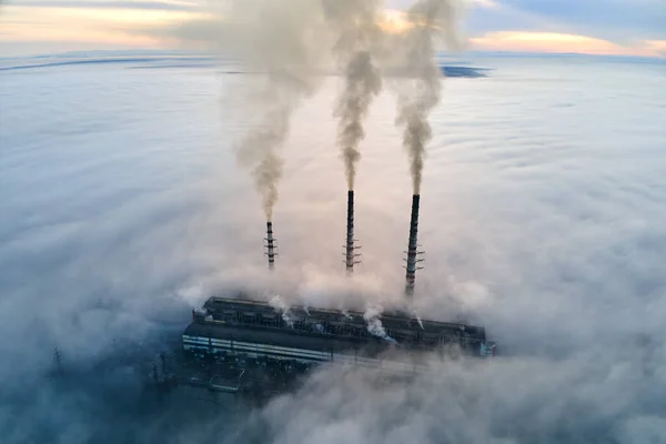 Coal power plant high pipes with black smoke moving upwards polluting atmosphere. Production of electrical energy with fossil fuel concept — Stock Photo, Image