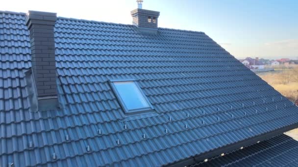 Aerial view of house roof top covered with ceramic shingles. Tiled covering of building under construction — Stock Video