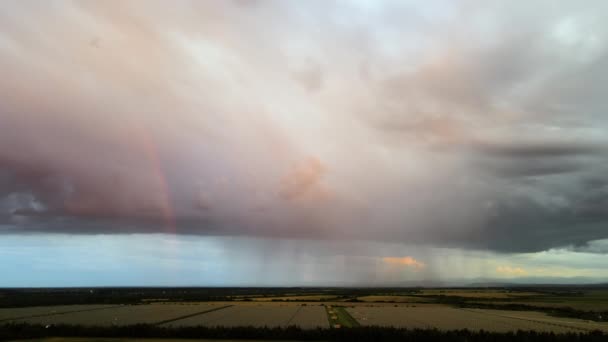 Landscape of dark clouds forming on stormy sky during thunderstorm over farmlands — Stock Video