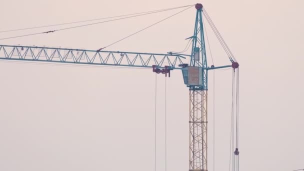 Tower crane at high residential apartment building construction site. Real estate development — Stock Video