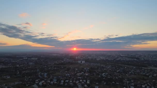 Aerial view of residential houses in suburban rural area at sunset — Stock Video