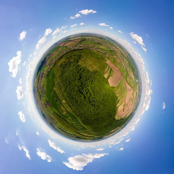 Aerial view from high altitude of little planet earth covered with white puffy cumulus clouds on sunny day — Stock Photo, Image