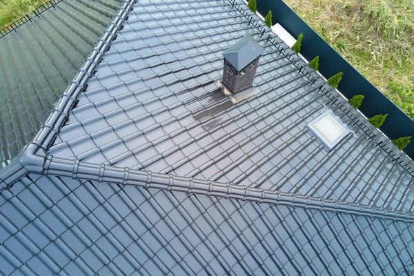 Closeup of house roof top covered with shiny ceramic shingles — Stock Photo, Image