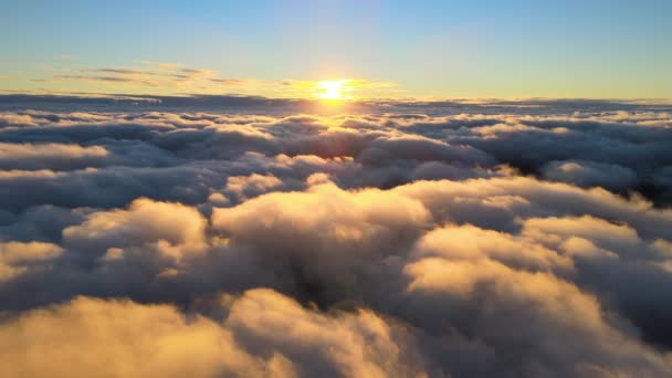 Aerial view from airplane window at high altitude of dense puffy cumulus clouds flying in evening — 图库视频影像