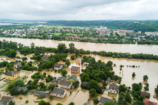 Aerial view of flooded houses with dirty water of Dnister river in Halych town, western Ukraine