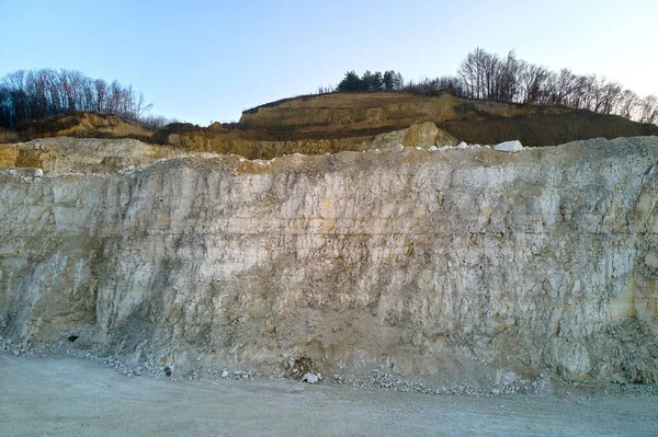 Open pit mining of construction sand stone materials