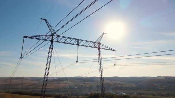 Steel pillar with high voltage electric power lines delivering electrical energy through cable wires on long distance — Stock Video