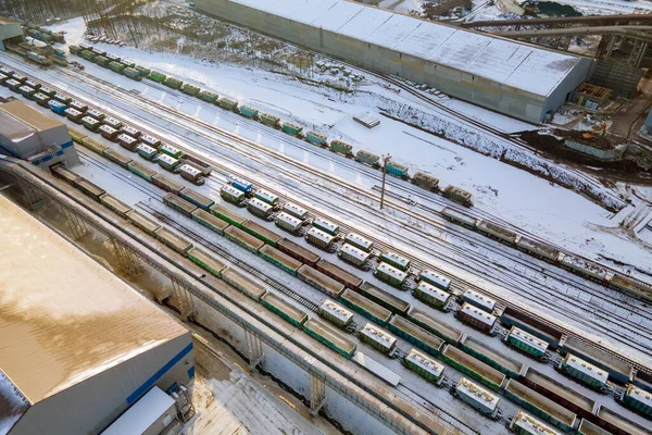 Aerial view of cargo train loaded with crushed sandstone materials at mine factory. Railway transportation of open pit mining ore — Stock Photo, Image