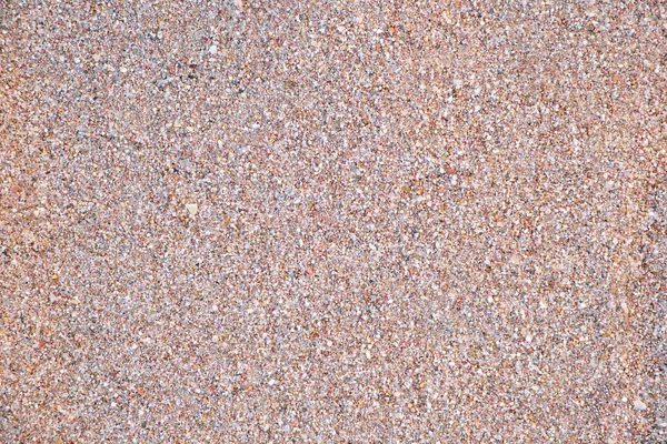 Vista plana da superfície limpa da areia amarela que cobre a praia à beira-mar. Textura arenosa — Fotografia de Stock
