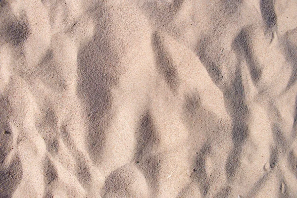 Vista plana da superfície limpa da areia amarela que cobre a praia à beira-mar. Textura arenosa — Fotografia de Stock