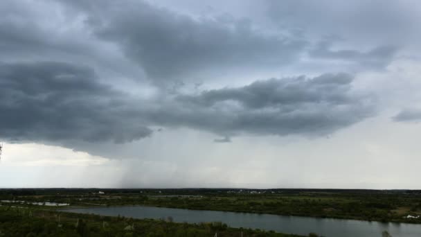 Landscape of dark clouds forming on stormy sky during thunderstorm over rural area — Stock Video