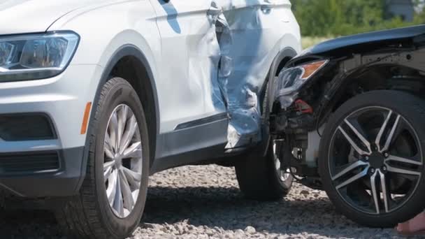 Sad female driver speaking on sellphone on street side calling for emergency service after car accident. Road safety and insurance concept — Stock Video