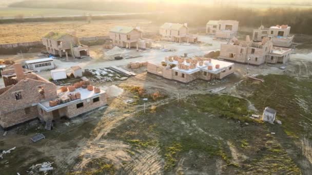 Aerial view of residential houses under construction in rural suburban area. Real estate development — Stock Video