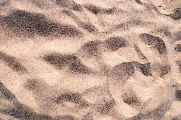 Flache Ansicht der sauberen gelben Sandoberfläche, die den Strand am Meer bedeckt. Sandige Textur — Stockfoto