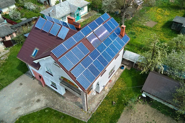 Private home roof covered with solar photovoltaic panels for generating of clean ecological electric energy in suburban rural town area. Concept of autonomous house — Stock Photo, Image