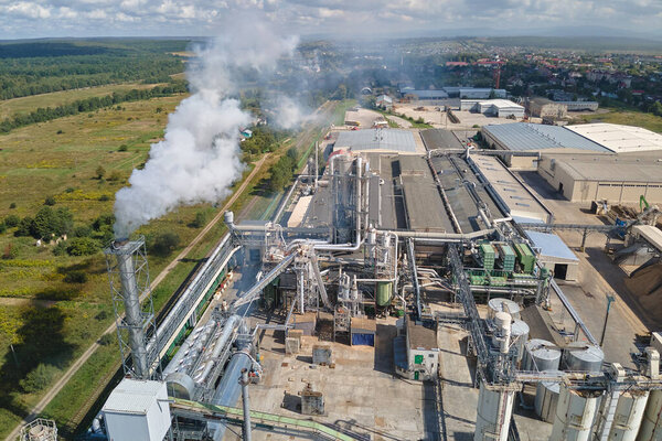 Aerial view of factory with high plant manufacture structure. Global production and manufacturing concept