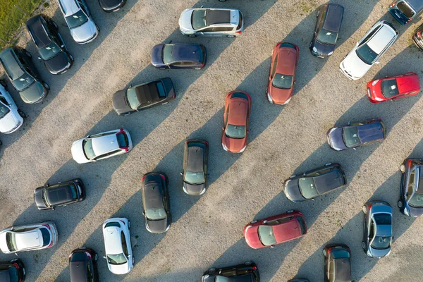 Aerial view of many colorful cars parked on dealer parking lot for sale — стоковое фото