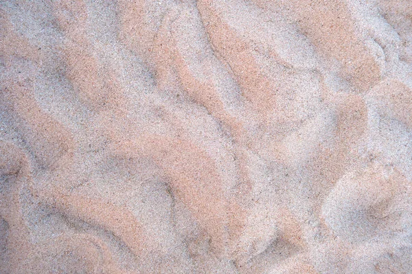 Vista piatta di superficie di sabbia gialla pulita che copre la spiaggia sul mare. Texture sabbiosa — Foto Stock